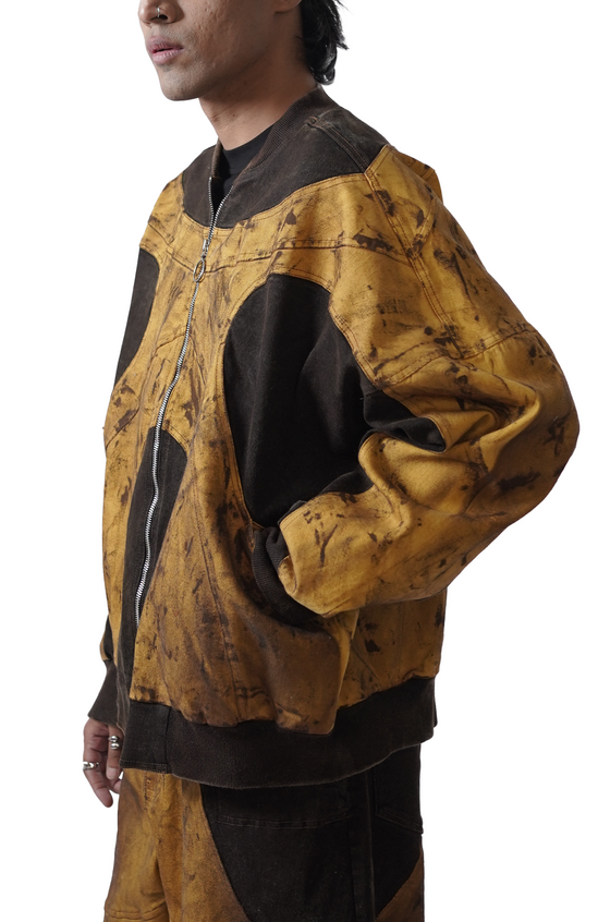 Oversized unisex panelled denim jacket with hand-painted mud washed surface (Copper)