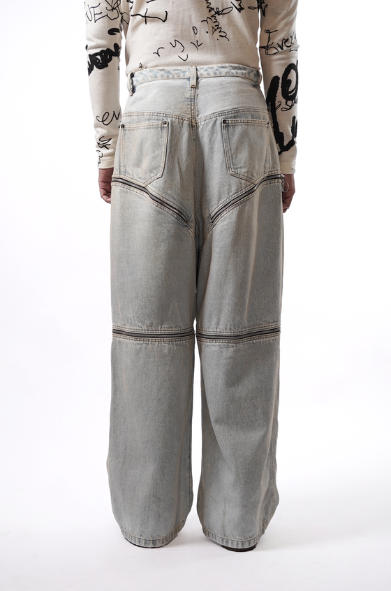 High-waisted zippered trousers with multi-zipper detailing (Indigo)