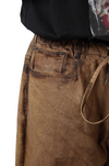 Oversized unisex denim with hand-painted mud-washed surface (Copper)