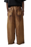 Oversized unisex denim with hand-painted mud-washed surface (Copper)