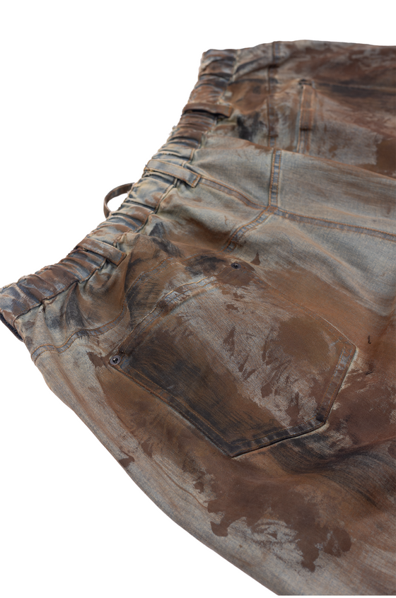 Oversized unisex denim with hand-painted dark mud-washed surface (Indigo)